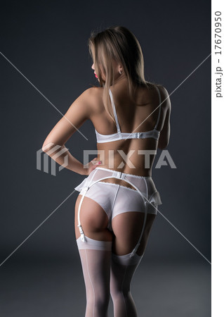 Back view of model in lingerie and garter belt - Stock Photo 17670950