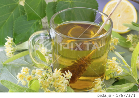 Lime tea with sugar stick, lemon and lime flowers 17677371