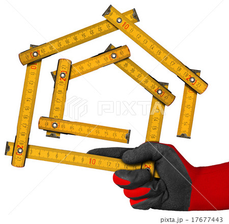 Gloved Hand Holding a Symbolic House Gloved Hand Holding a Symbolic House 17677443