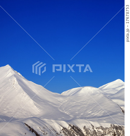 Snowy mountains and blue clear sky at nice morning 17678753