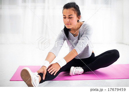Fit woman doing aerobics gymnastics stretching 17679459