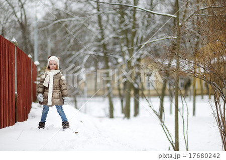 Adorable little girl having fun on winter day 17680242