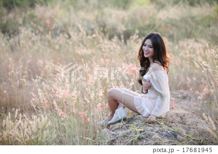 Beautiful woman holding flower Beautiful woman holding flower 17681945