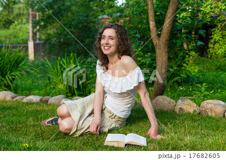 Beautiful romantic woman with book outdoors 17682605