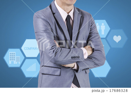 Business man standing on blue background. 17686328