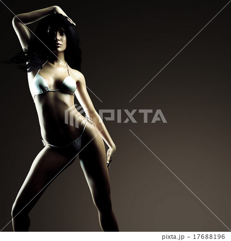 Sexy brunette bikini woman posing in dark studio Sexy brunette bikini woman posing in dark studio 17688196
