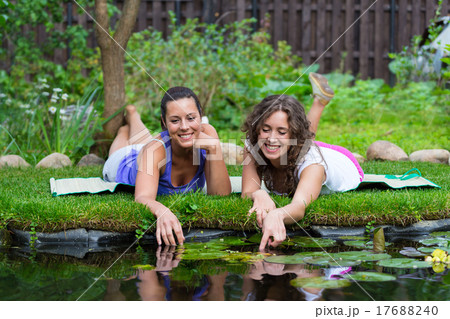 Two beautiful young brunet woman outdoors Two beautiful young brunet woman outdoors 17688240
