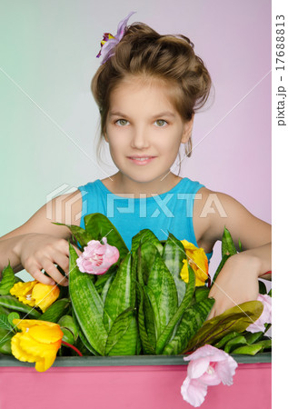 happy girl is caring for flowers 17688813