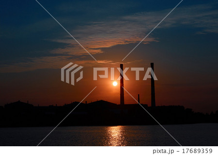 factory in silhouette and sunrise sky factory in silhouette and sunrise sky 17689359