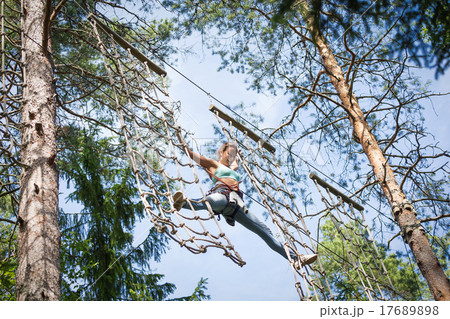 Woman at adventure rope park 17689898