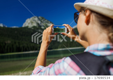 The girl in the hat makes a smartphone photo The girl in the hat makes a smartphone photo 17690534