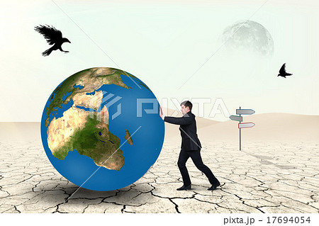 Businessman pushes world sphere 17694054