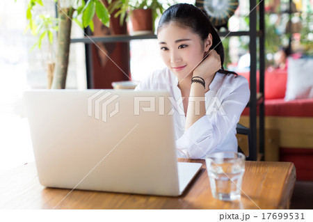 beautiful hipster woman using laptop at cafe beautiful hipster woman using laptop at cafe 17699531