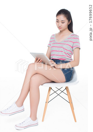 girl sitting on a chair 17699652
