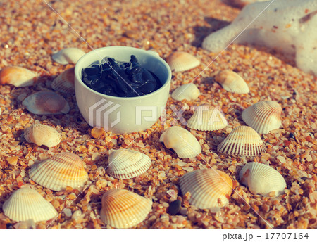Dead Sea mud in a cup on the seashore 17707164