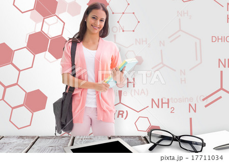 Composite image of pretty student smiling at camera 17711034