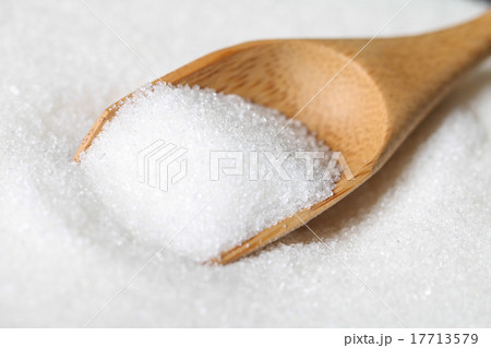 sugar in a wooden spoon 17713579