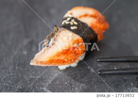 close-up of chopsticks and eel nigiri 17713652
