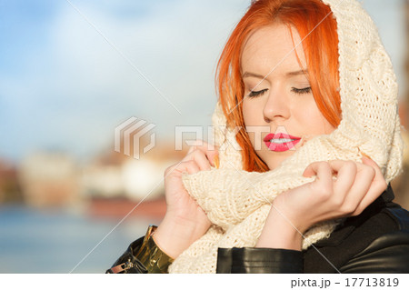 Beauty red hair woman in warm clothing outdoor Beauty red hair woman in warm clothing outdoor 17713819