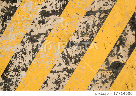 Yellow and black stripes on the concrete surface Yellow and black stripes on the concrete surface 17714606