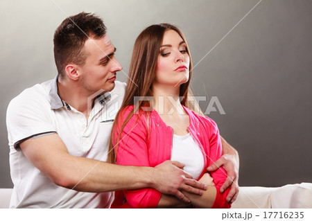 Husband hugging unhappy wife. Offended woman. 17716235