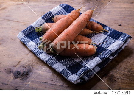 Fresh homemade carrot loose on a wooden table. Fresh homemade carrot loose on a wooden table. 17717691