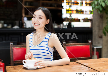 cute asian woman drinking coffee cute asian woman drinking coffee 17718094