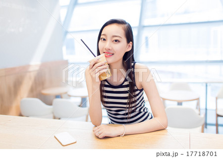 girl sitting in a coffee shop girl sitting in a coffee shop 17718701