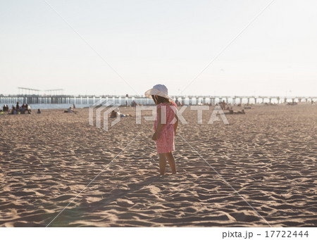 Little girl walking on the beach Little girl walking on the beach 17722444