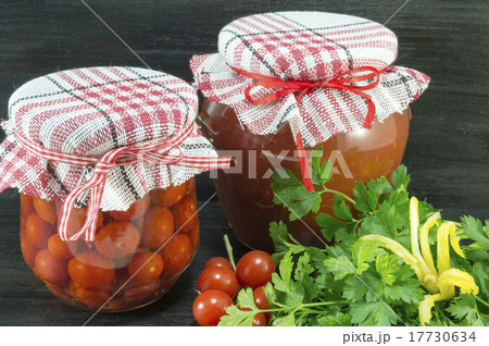 Jars of homemade ketchup and cherry tomato  17730634