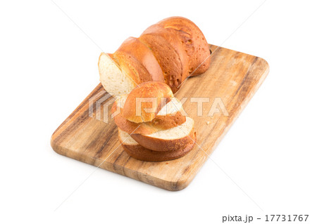 Sliced bread on a wooden chopping board 17731767