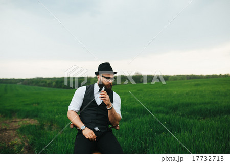 man with a beard, thinking in the field man with a beard, thinking in the field 17732713