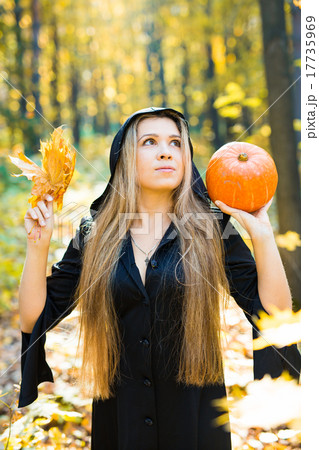 portrait of beautiful blond young woman holding 17735969