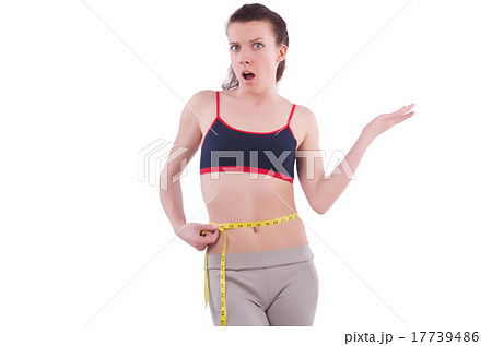 Young girl with centimeter in dieting concept Young girl with centimeter in dieting concept 17739486