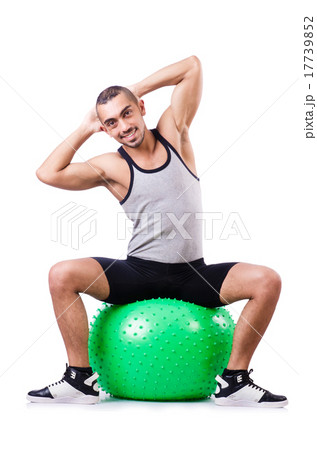 Man with swiss ball doing exercises on white Man with swiss ball doing exercises on white 17739852