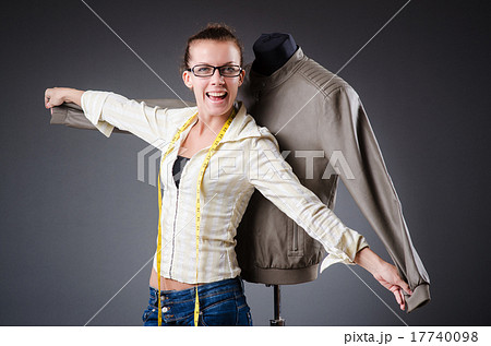 Woman tailor working on clothing Woman tailor working on clothing 17740098