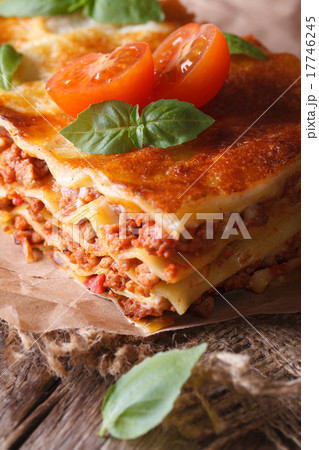 Hot lasagna with basil and tomatoes on table Hot lasagna with basil and tomatoes on table 17746245