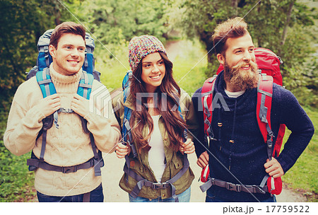 group of smiling friends with backpacks hiking 17759522