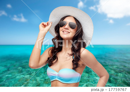 happy young woman in bikini swimsuit and sun hat 17759767