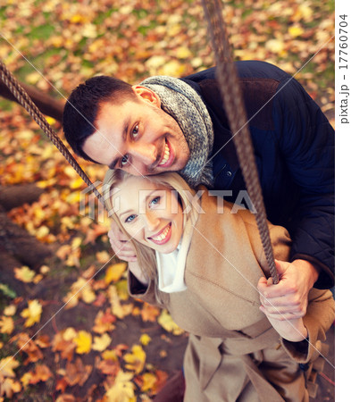smiling couple hugging in autumn park smiling couple hugging in autumn park 17760704