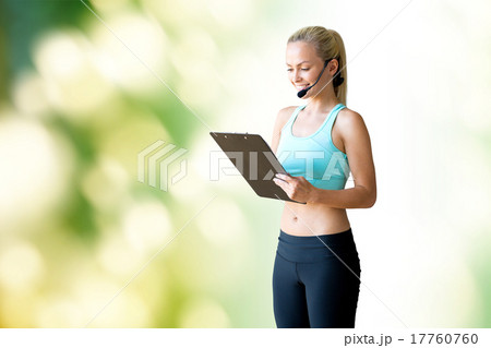 happy woman trainer with microphone and clipboard happy woman trainer with microphone and clipboard 17760760