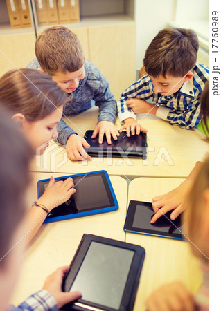 group of school kids with tablet pc in classroom 17760989
