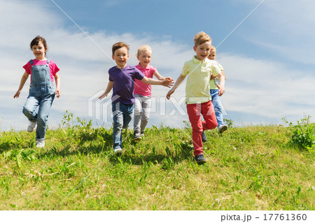 group of happy kids running outdoors group of happy kids running outdoors 17761360