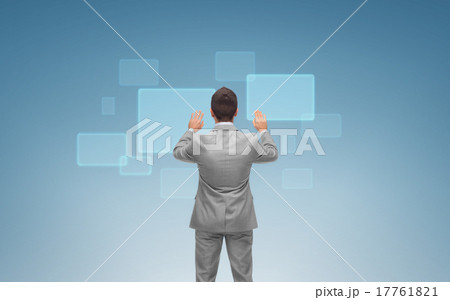 businessman working with virtual screens businessman working with virtual screens 17761821