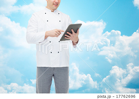 close up of happy male chef cook holding tablet pc 17762696