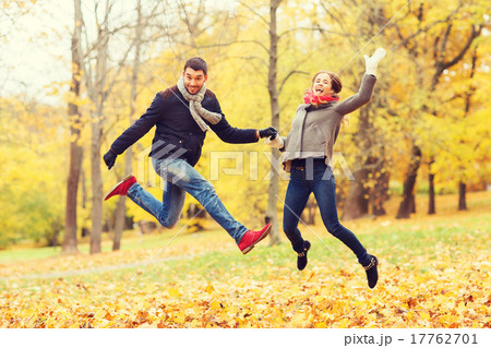 smiling couple having fun in autumn park smiling couple having fun in autumn park 17762701