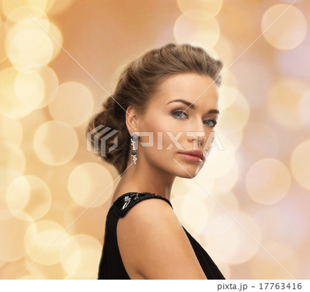 beautiful woman in evening dress wearing earrings 17763416