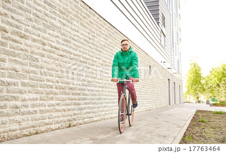 young hipster man riding fixed gear bike 17763464