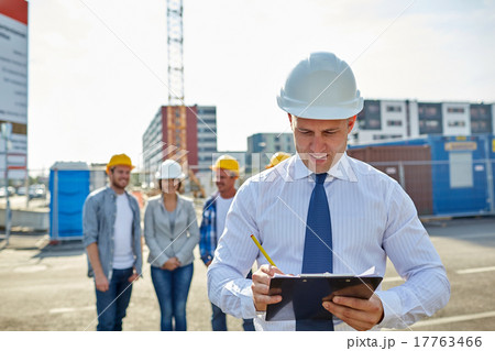 happy builders and architect at construction site 17763466