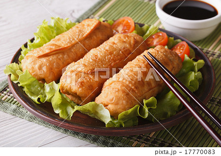 spring rolls fried on a plate close-up and sauce spring rolls fried on a plate close-up and sauce 17770083